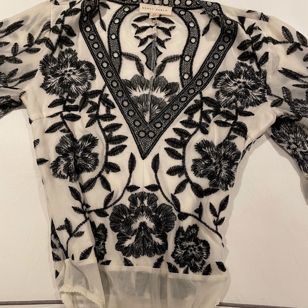 Honey Punch bodysuit in size XS. Deep V neck.